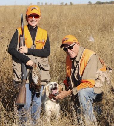 Hope Miller during her first pheasant hunt in North Platte through the Pheasants Forever Mentor Hunt. She is pictured with mentor Kert McKeone of North Platte and his dog Koda.