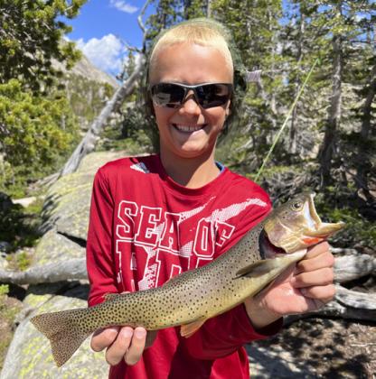 Teal Peterson with a yellowstone cutthroat trout he caught this summer on a backcountry fly fishing backpacking trip in Wyoming with his dad, Dane, and Uncle Colby and Aunt Amanda Osborn.