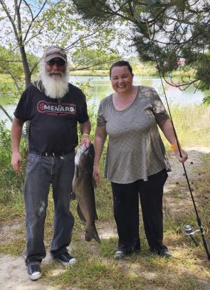 Gary Schwaderer and his daughter Crystal Hessin caught this catfish together.