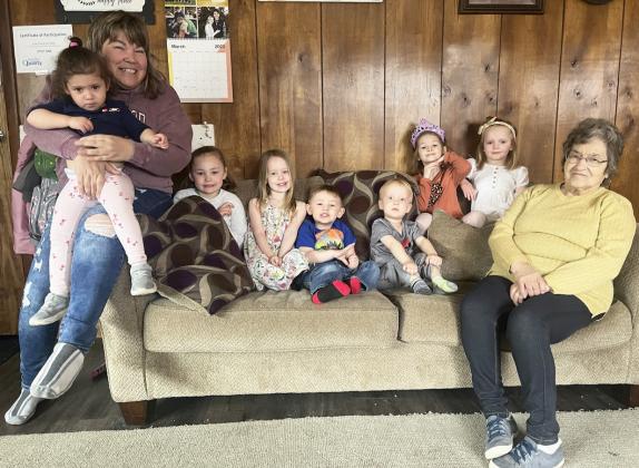 Pictured left to right on Monday at Lots of Love Day Care: Lori Folk holding Ellianna Collins, Brogan Jewell, Aurora Polt, Chasin McIntosh (sister Ady was sleeping), Arthur Polt, Ryhme Pettit, Ryann Walz and “Grandma” Ruby Folk. Gerri Peterson