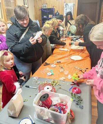 40 kids created wooden snowmen at the Mullen Arts Center during the Walkabout