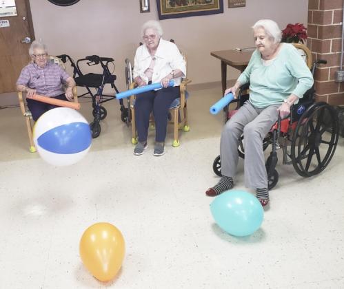 Nadene Andersen, Minnie Mary Hamilton and Marty Boyer playing noodle ball.
