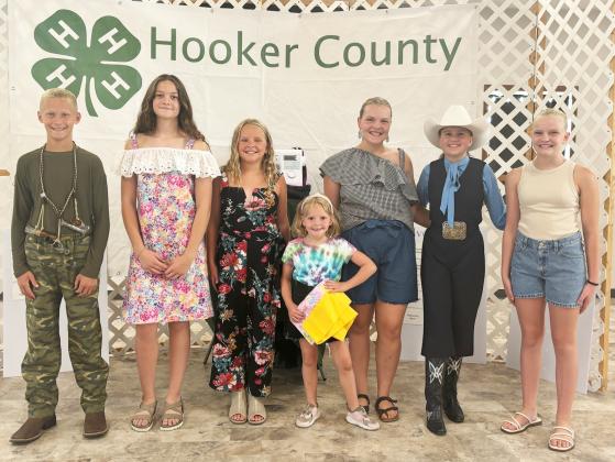 4-H Style Revue participants, l-r: Teal Peterson, Ava Kvanvig, Ella Walz, Ryann Walz, Maci Walz, Audrabell Werth, Ava Walz. Gerri Peterson