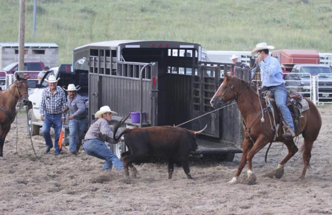 The team of Cash Talementz, Lance Moore, Peyton Barner and Baily Holt (not pictured) compete in the team loading and branding event.