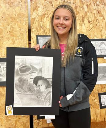 MHS senior Izzy Hoyt was the top senior high artist at the Mullen Art Show last Tuesday, April 15, by earning the most points. She is pictured with her personal favorite piece she had in the show. Mullen Senior High and Mullen Junior High both placed first in the show. Full results were not available at press time, but watch next week’s issue for them. Gerri Peterson