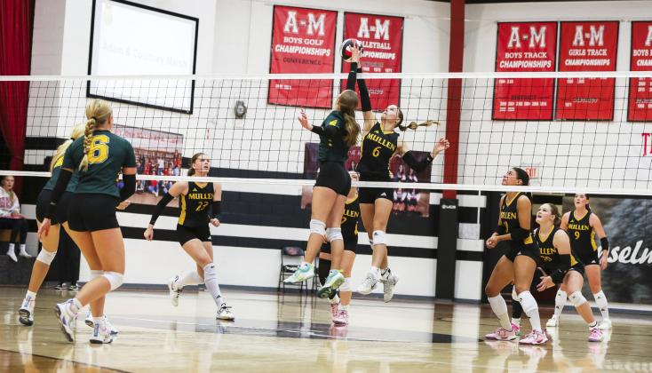 Brynne McCully battles at the net in the championship game last Saturday with teammates Chloe Newman, Kalli Licking, Ella Rice, Emerson Thorberg and Jenna Donohoe ready. Megan Andersen