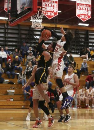 Luke Durfee goes up for a shot at Valentine last Tuesday. Megan Andersen
