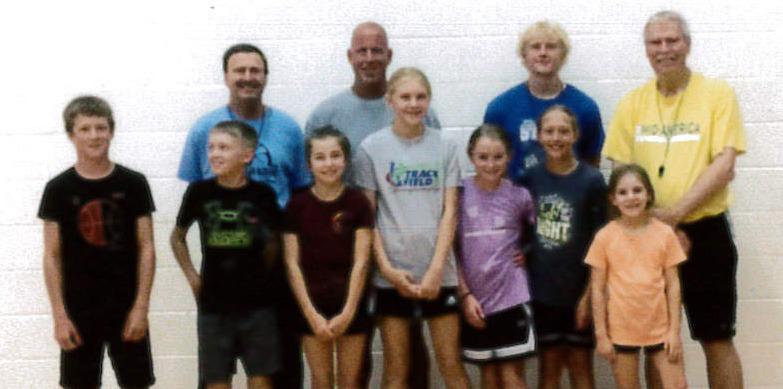 Back, l-r: Coaches Bill Gavers, James Lowry, Riley Bombeck and Mike Trader. Front: Cylas Dent, Kyler Marsh, Lillian Ericksen, Hadley Marsh, Avery Vinton, Emri Dent, Eve Ericksen. courtesy photo