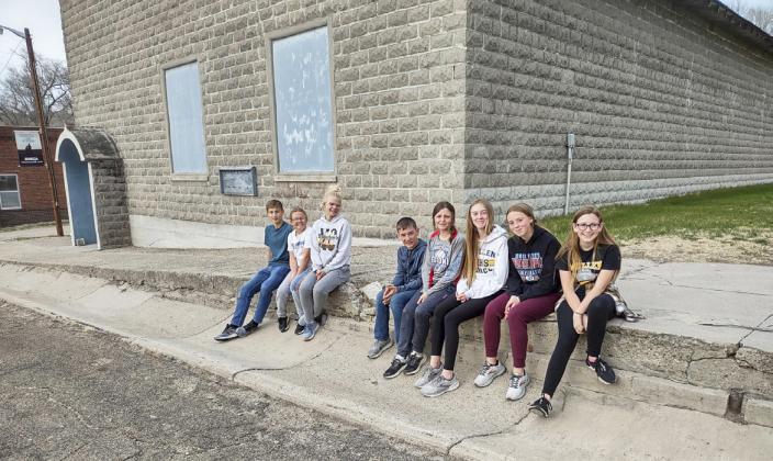 JH MYF kids in front of the Seneca Auditorium before their project last year, l-r: Alex Werner, Riley Hegland, Tierston Moore, Hunter Brown, Kalli Licking, Sydnee Cheever, Harper Andersen, Hope Miller. Dawn Mallory