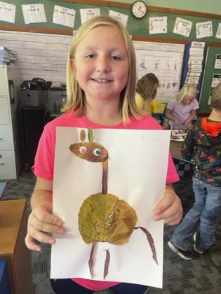 The 2nd grade students recently went on a leaf hunt to find the perfect leaves to create a leaf animal. Pictured is Tatum Deibler.