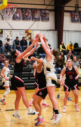 Hayley Donohoe fights for a rebound against Anselmo-Merna. Megan Andersen