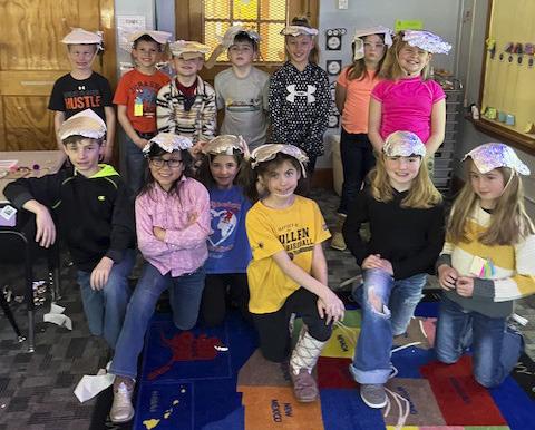 In science, the 2nd grade students explored the different properties of materials used for clothing, such as texture, flexibility, and absorbency. Then they used this information to design and build a hat that protects them from the sun. They have also been practicing adding 3-digit numbers. Emily Brown