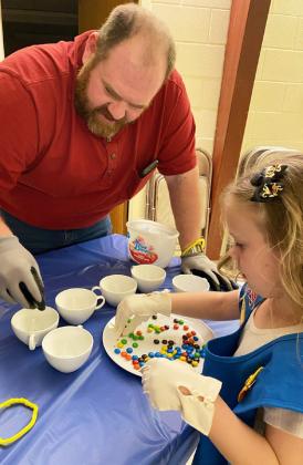 Kinley Crisp and her dad Tanner during the Minute to Win It games.