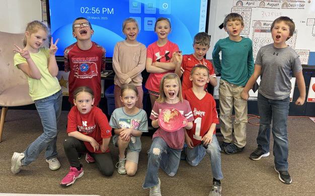 First graders learn how to make butter