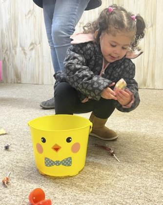 Ellianna Collins works on filling her bucket.