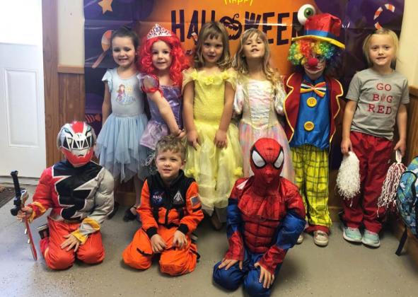 The older class is pictured back, l-r: Ellie Licking, Eve Ericksen, Aislynn Connealy, Polly Stephan, Dailie Dent, Danielle Peterson. Front: Merick Lattin, Tate Phillips, Gabriel Diaz.