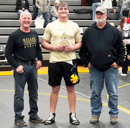 MHS senior Tate Kvanvig was awarded the Gary Hoyt Outstanding Wrestler Award at the Mullen Invite. The coaches voted for the award at the end of the tournament to determine the recipient. He is pictured with Phil Hoyt (left) and Todd Hoyt.
