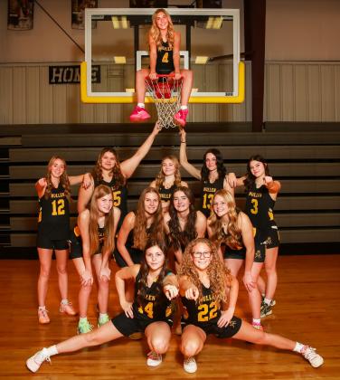 Girls basketball: Peyton Paxton on the hoop, back l-r: Harper Andersen, Mia Flores-Green, Hayley Donohoe, Fayth Brown, Georgia Wingebach. Middle: Chloe Newman, Brynne McCully, Jenna Donohoe, Emerson Thorberg. Front: Kalli Licking, Riley Hegland. Megan Andersen Photography