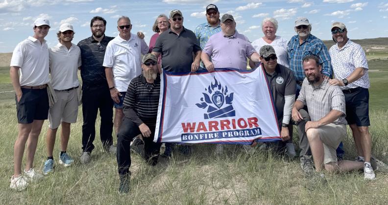 Pictured is Jeremey Johnson, Mike Diehn, Joey Garrido, Zach Friel, Johnny Raines, Denis Oliverio, Sally Sherman-Ruelas, Vicki McClain, Mike Foss, Gregg Mallory and caddies Chase and Brady at Sand Hills Golf Club. courtesy photo