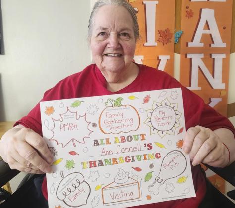 Left: Robert Prentice holding our new Christmas decoration given to us by Mildred Szwanek and Kathy Tuton. Thank you ladies, it’s perfect. Above: Ann Connell with her Thanksgiving paper that we worked on the week of Thanksgiving.