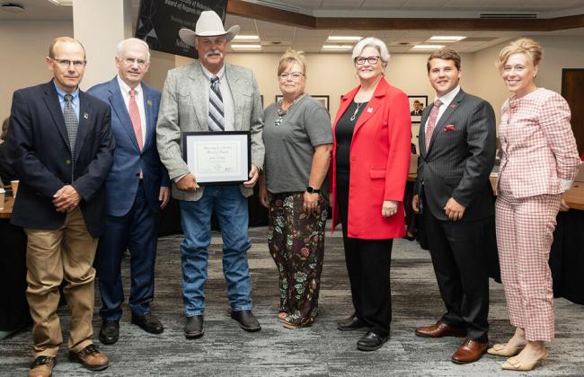 John Nollette (third from left, with his wife Stacy next to him) received a Kudos Award during the June 18 meeting of the University of Nebraska Board of Regents. courtesy photo