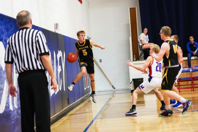 Kyle Finney hustles to keep the ball in bounds for the Broncos against Medicine Valley.