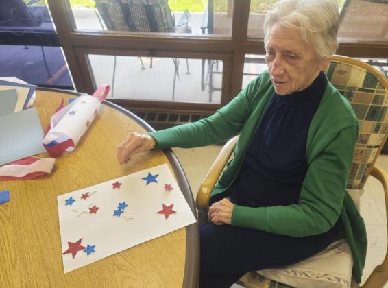 Wanda Mackley working on the windsock craft.