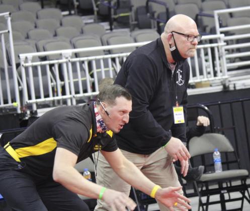 Kris Forsen MHS wrestling coaches Bo Pettit (left) and Russ Monette matside during a Bronco State Wrestling match.