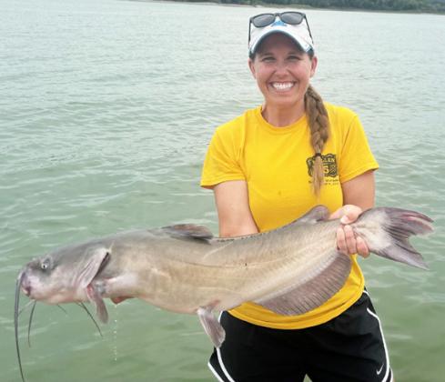 Gerri Peterson went from “watching the lines” while her family was tubing, to reeling in a master angler catfish!