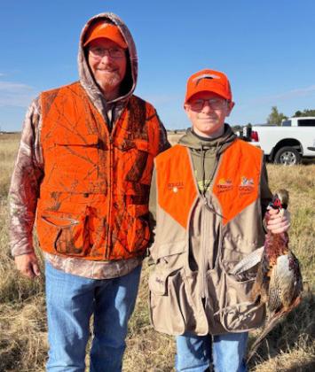Bryan and Oakes Miller pheasant hunting south of North Platte.