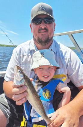 Mason Deibler with his dad Anthony. Mason wasn’t too sure about his first walleye!