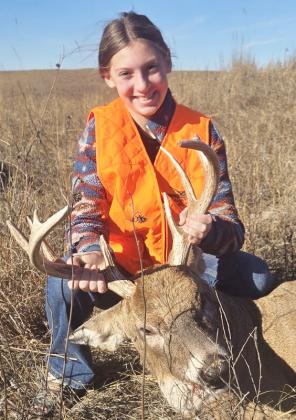 Olivia Cox with her first deer.