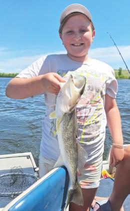Tatum Deibler with her catch of the day.