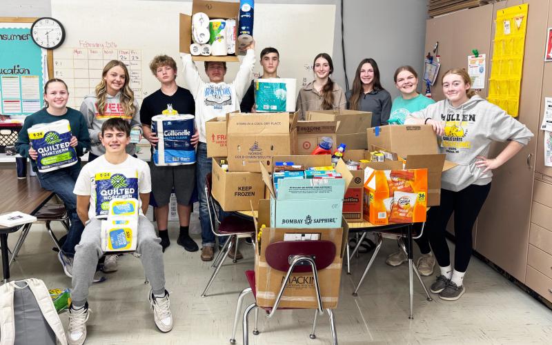The freshman class is pictured with some of the donations to the Mullen Food Pantry, l-r: Audrabell Werth, Braylon Kuncl, Kaisley Phipps, DJ Coetzee, Cody Walker, Bo Pettit, Jr., Abby Gracey, Breckyn Burney, Maci Walz, Kassidy Cheever. Kelli Walz