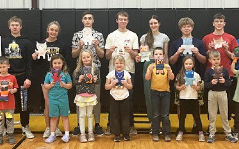 Freshmen create personalized monsters for kindergartners