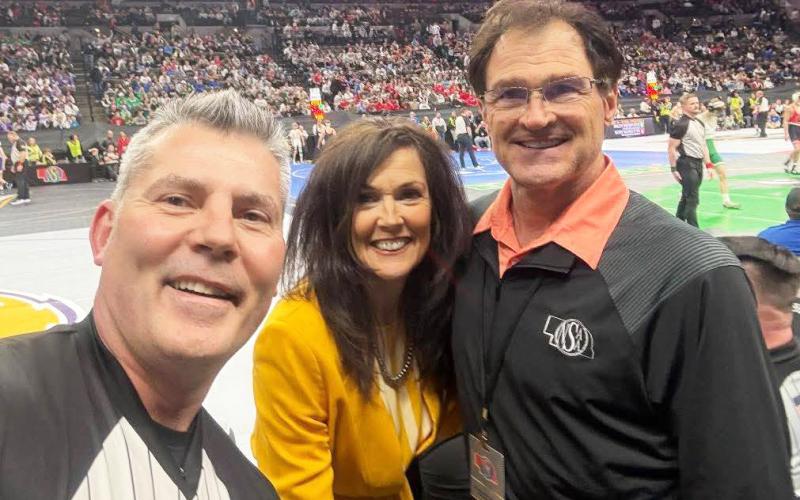 Bill and Robin Phipps at State Wrestling with Dale Bean of Kearney (left) who was honored for 25 years as a referee. courtesy photo