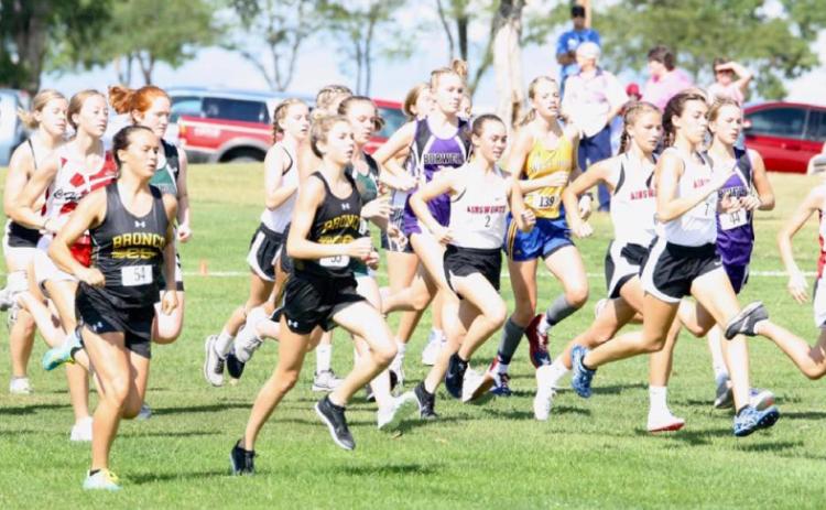 Bronco cross country girls Callie Coble (left) and Peyton Paxton begin their race at Ainsworth last week. Sue Licking