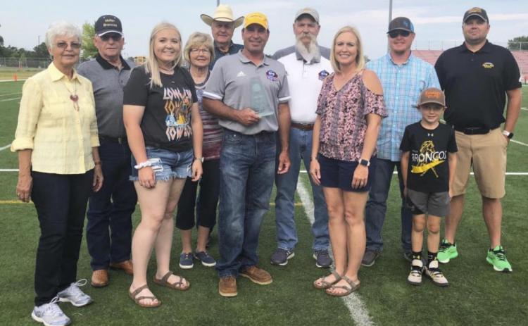 Wade Edis surrounded by family last Saturday after he was inducted into the Eight-Man Football Hall of Fame. Pictured l-r: Pat and Bob Edis, Jaci Edis, Peggy and Bob Marsh, Wade Edis, Coach Mike Brown, Jeri Edis, Lane Edis, Kyler and Wade Marsh. Barb McIntosh
