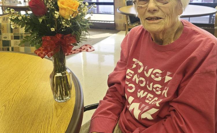 Marlene Dykes with her Valentine’s Day flowers.