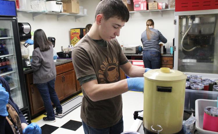 Kathy Leibhart, Nita Zimmerman, Lori Vinton, Hunter Brown and Morgan Hassett making lattes, frappuccinos, smoothies and hot chocolates on Thursday, Jan. 25.