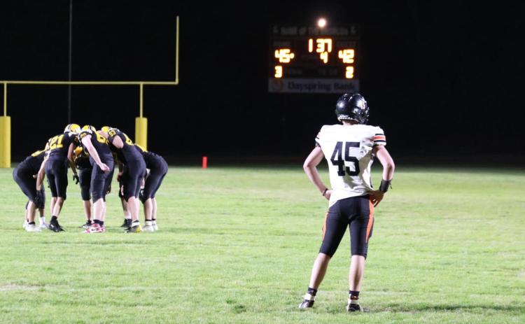 The Broncos huddle up in the last 1:37 left of the game last Friday night. Carolee Brown