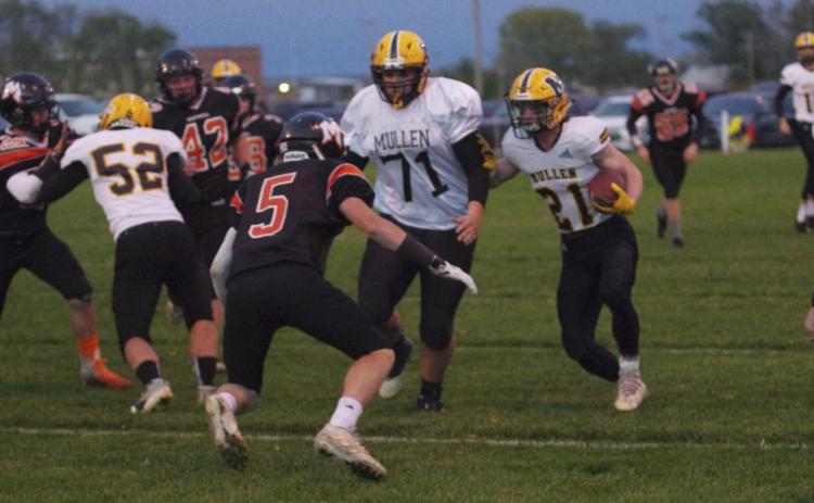 Kyle Durfee follows his blocks by #52 Adam Wiens and #71 Isaac Welch at Maxwell. Pam Ginkens