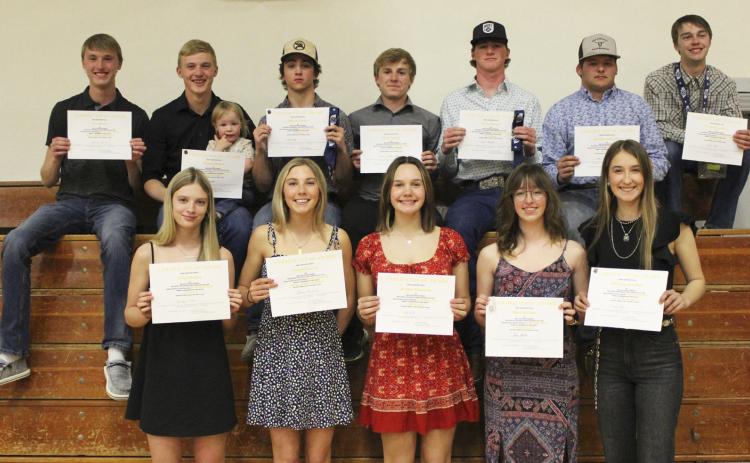 Sportsmanship winners, back l-r: Alex Moore, Clayton Moore (holding future Bronco Beckett Wright), Jeffery Forsen, Kyle Finney, Chase Gracey, Deacon DeNaeyer, Jacob Wingebach. Front: Erika Massey, Peyton Paxton, Ashlyn Simonson, Malia Oltmer, Whitney Jennings. Gerri Peterson