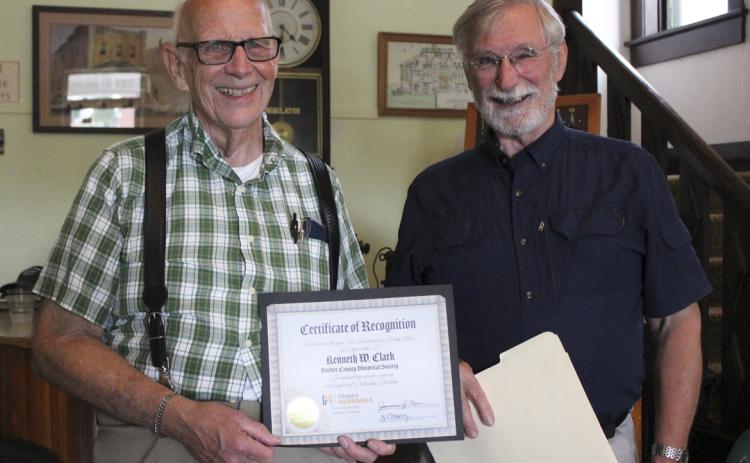 Nearly 70 people attended Ken Clark’s farewell reception at the Old Hotel last week the day before he left for his move to California. Among those was Bob Wickersham (right) from History Nebraska to present Ken with the Heritage Hero Award. Gerri Peterson