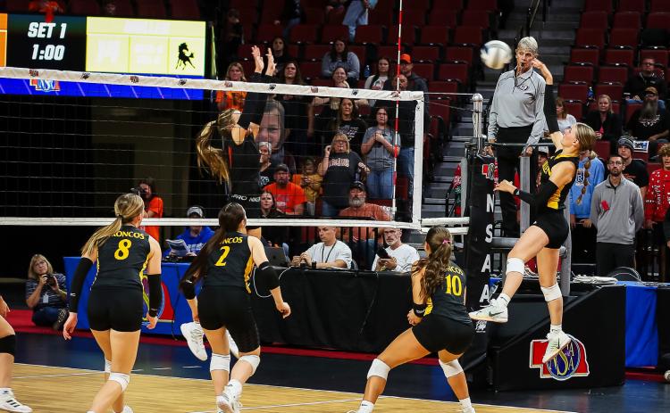 Brynne McCully goes up for a kill at state volleyball last Thursday, with Harper Andersen, Kalli Licking and Ella Rice covering. Megan Andersen