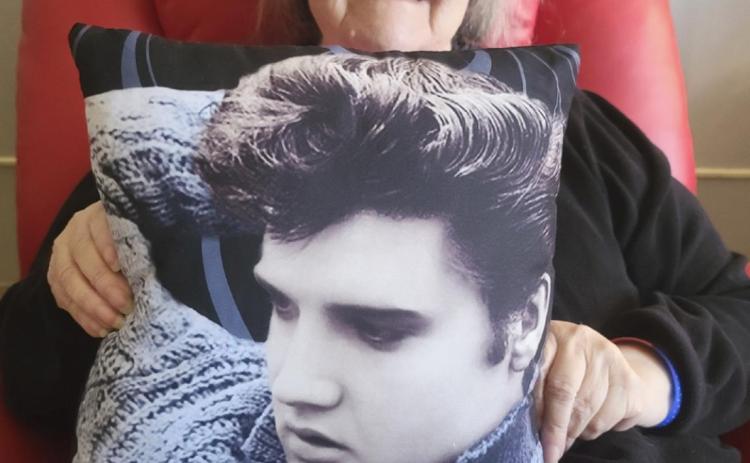 Ann Connell celebrating Elvis Presley’s birthday with her Elvis pillow.