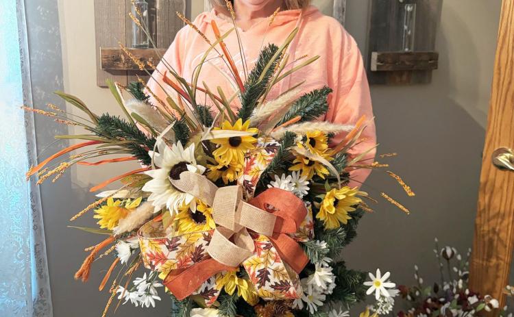 Teresa Hampton with one of the swags she has made. Gerri Peterson