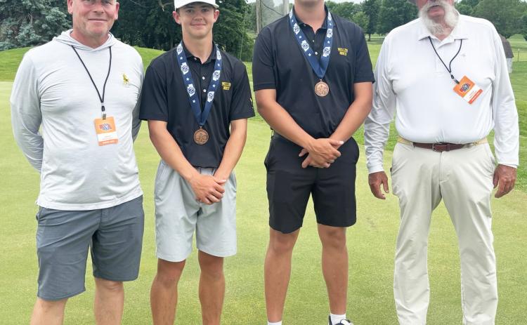 L-r: MHS Assistant Golf Coach Clint Svoboda, Ben Werner, Jacob Walker and Head Golf Coach Mike Brown at State Golf last week. Dominique Werner