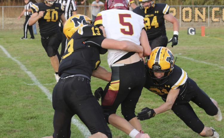 Chase Gracey and Cayden Hampton take down a Warrior last Friday. Carolee Brown