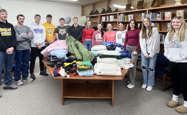 Mullen High School’s National Honor Society students traveled to Omaha this past weekend on a service trip. The community first donated to the NHS Winter Warm Up Drive, where 39 coats, 27 blankets and numerous pairs of gloves and hats were collected. NHS students are pictured above with them, l-r: Jackson Vinton, Jason Kraus, Cayden Hampton, Tate Kvanvig, Brandon Hardin, Alex Werner, Harper Andersen, Kalli Licking, Riley Hegland, Ella Rice, Ady Hampton, Sydnee Cheever, Hayley Donohoe. Kara Connealy